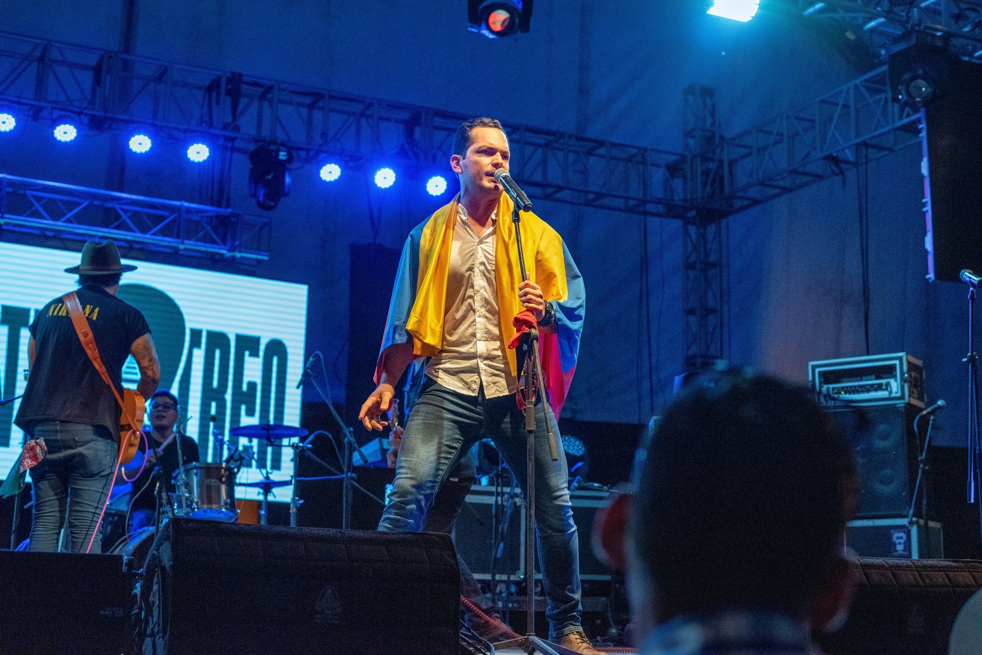 woman wearing yellow long-sleeved dress under white clouds and blue sky during daytime