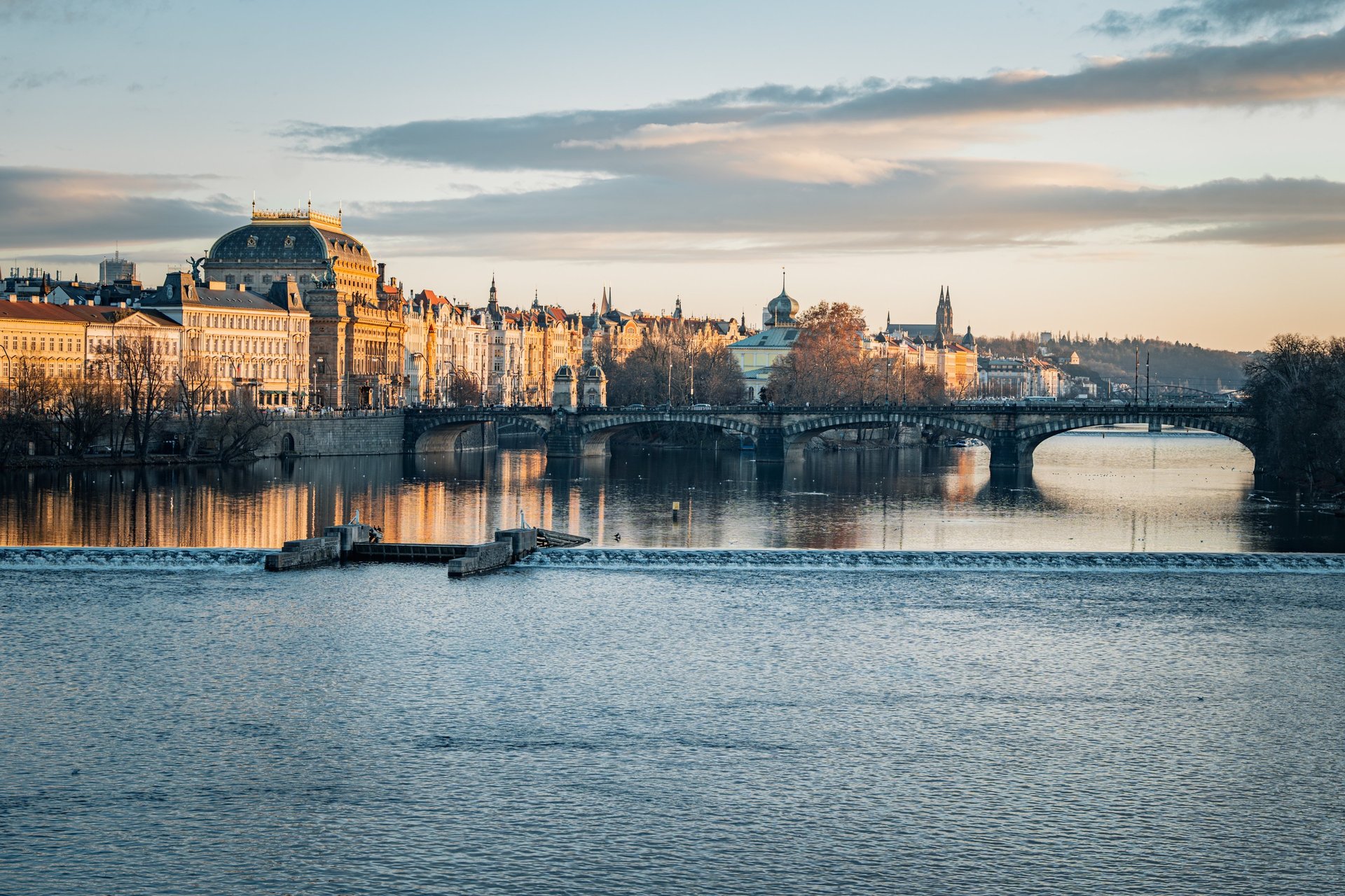 an abstract photo of a curved building with a blue sky in the background
