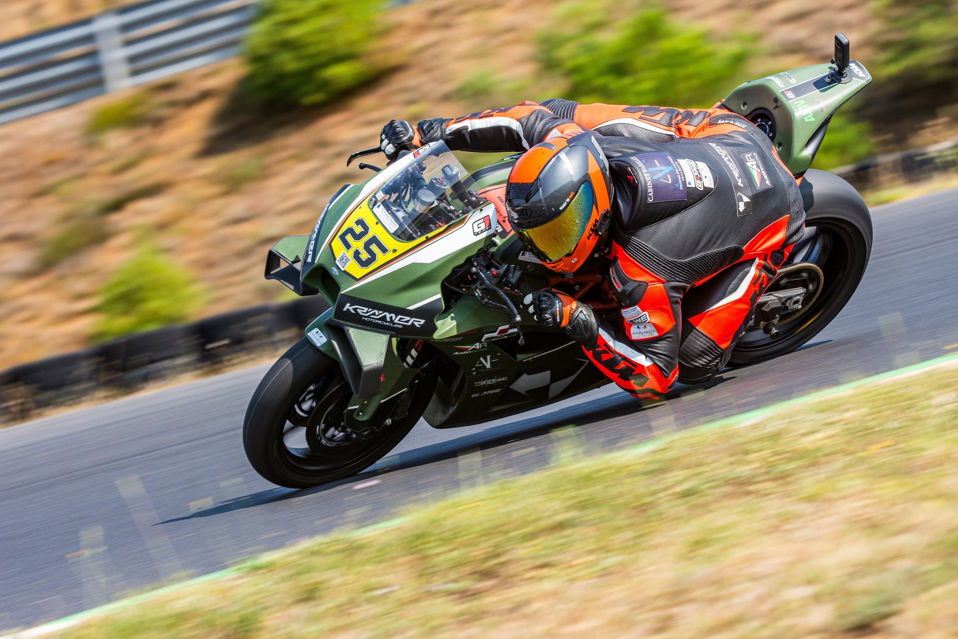 person sitting in a motorcycle during daytime selective photography