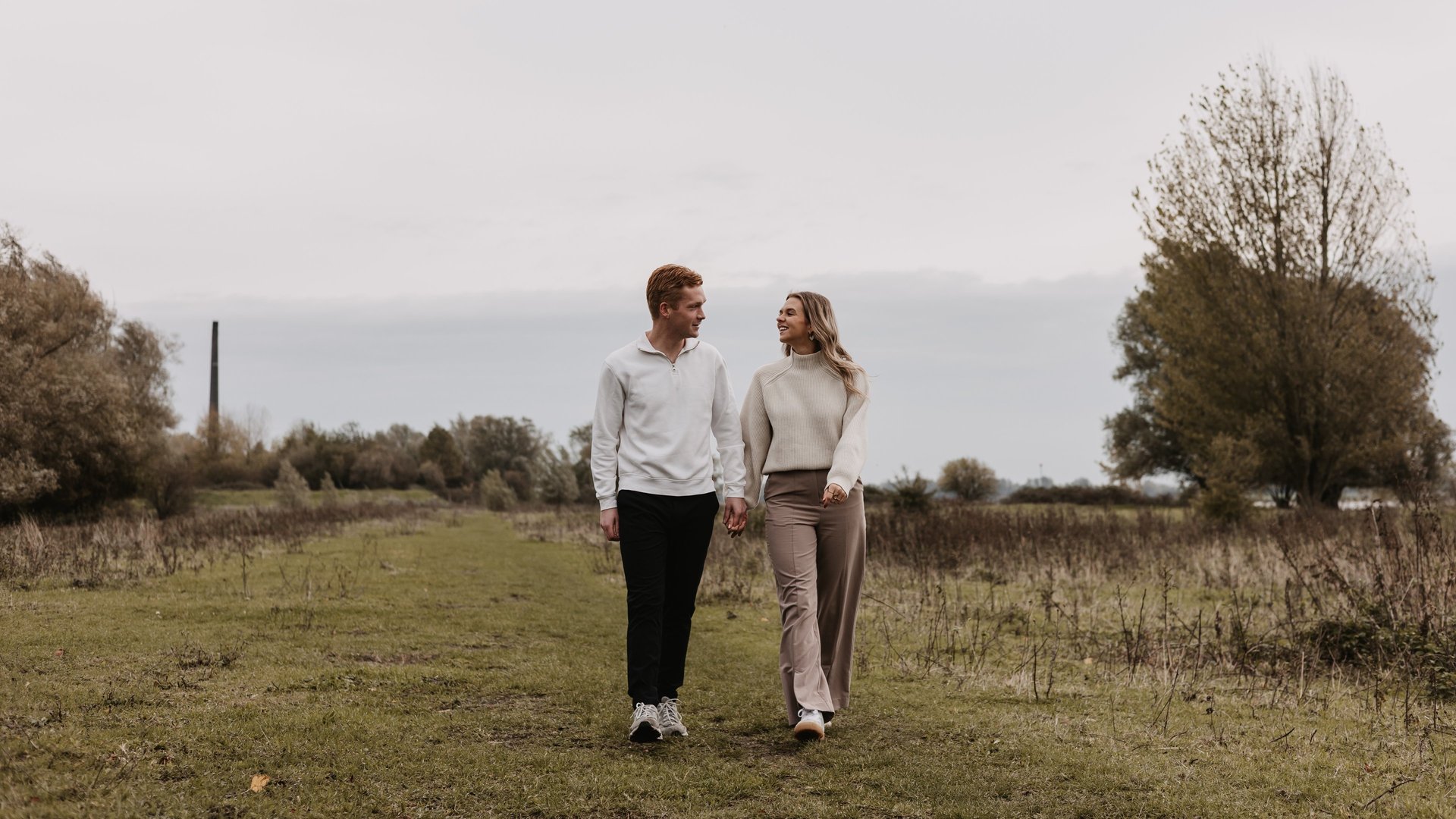 an abstract photo of a curved building with a blue sky in the background