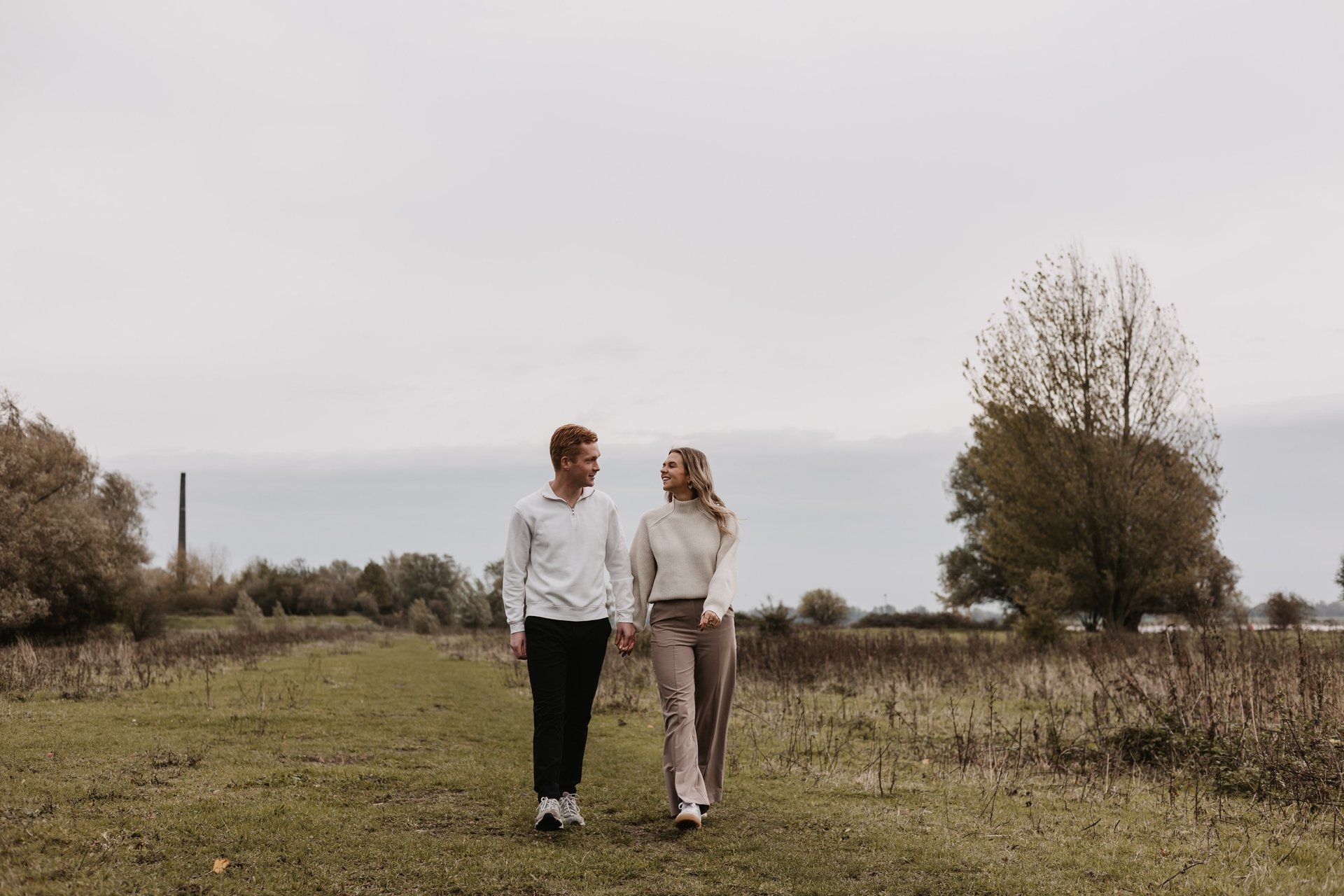 an abstract photo of a curved building with a blue sky in the background