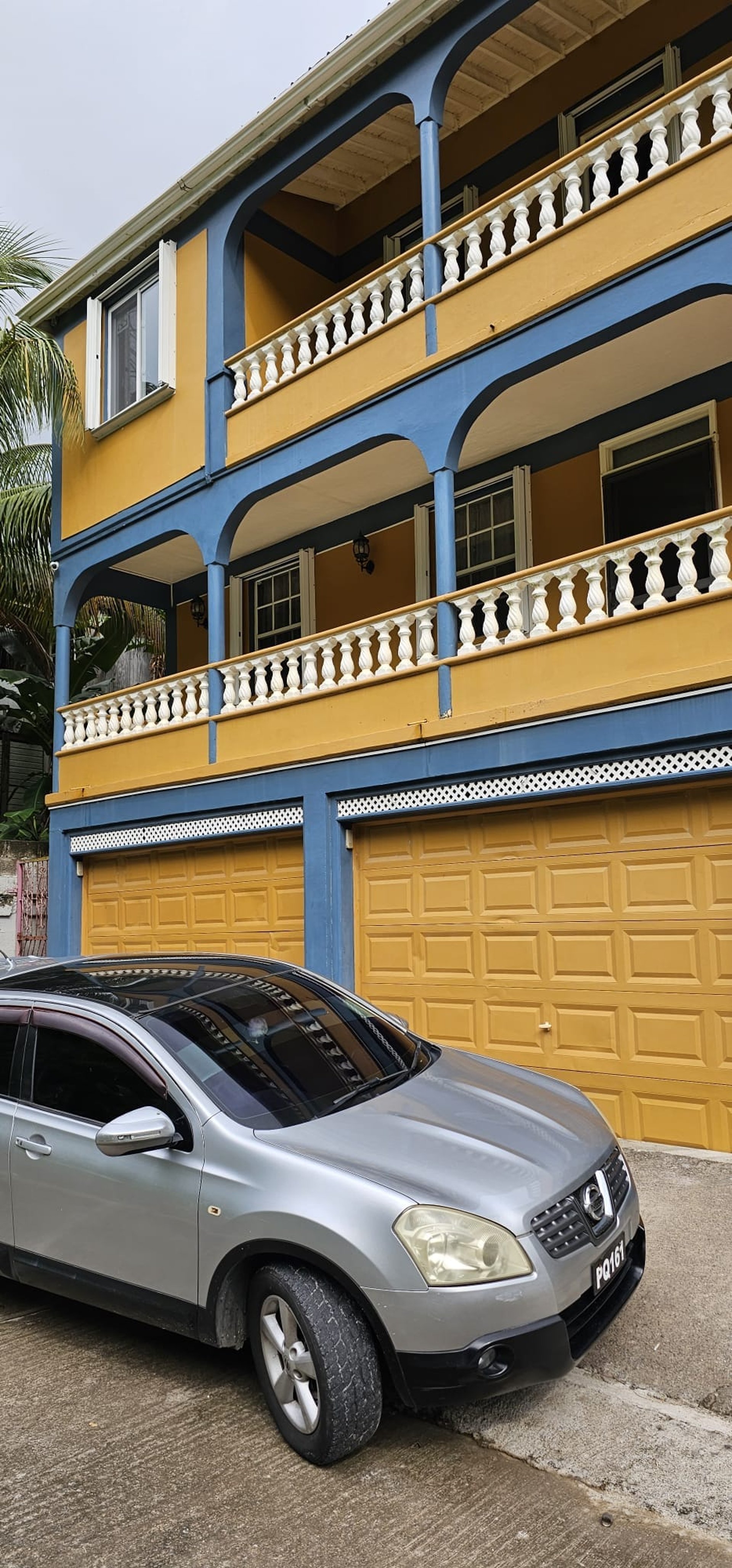 woman wearing yellow long-sleeved dress under white clouds and blue sky during daytime