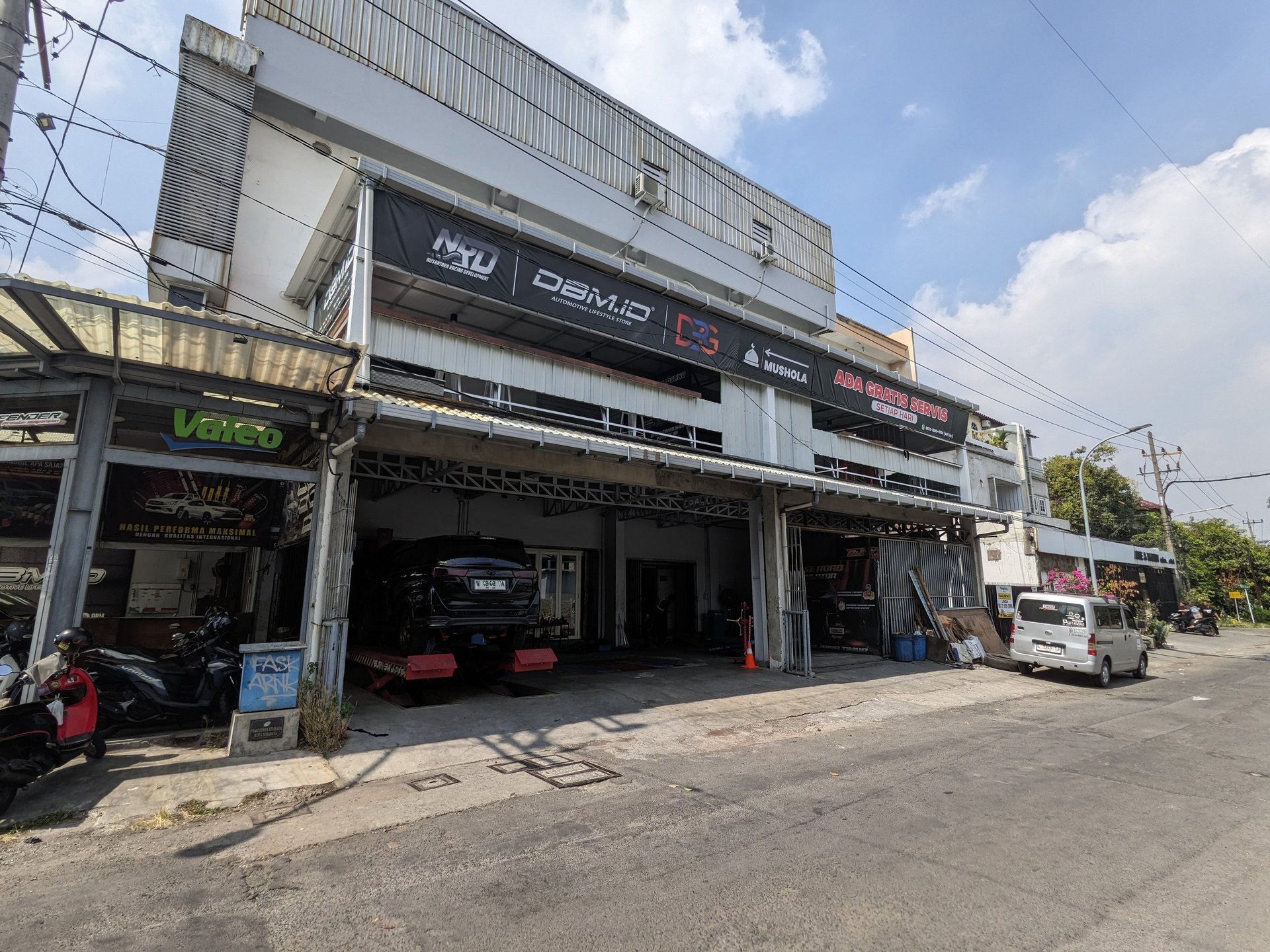 an abstract photo of a curved building with a blue sky in the background