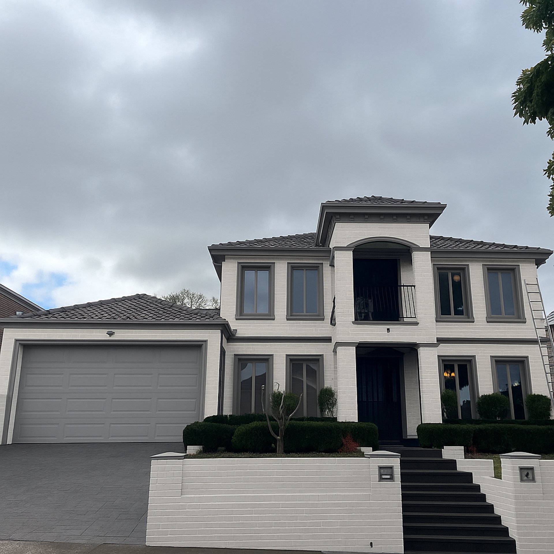 an abstract photo of a curved building with a blue sky in the background
