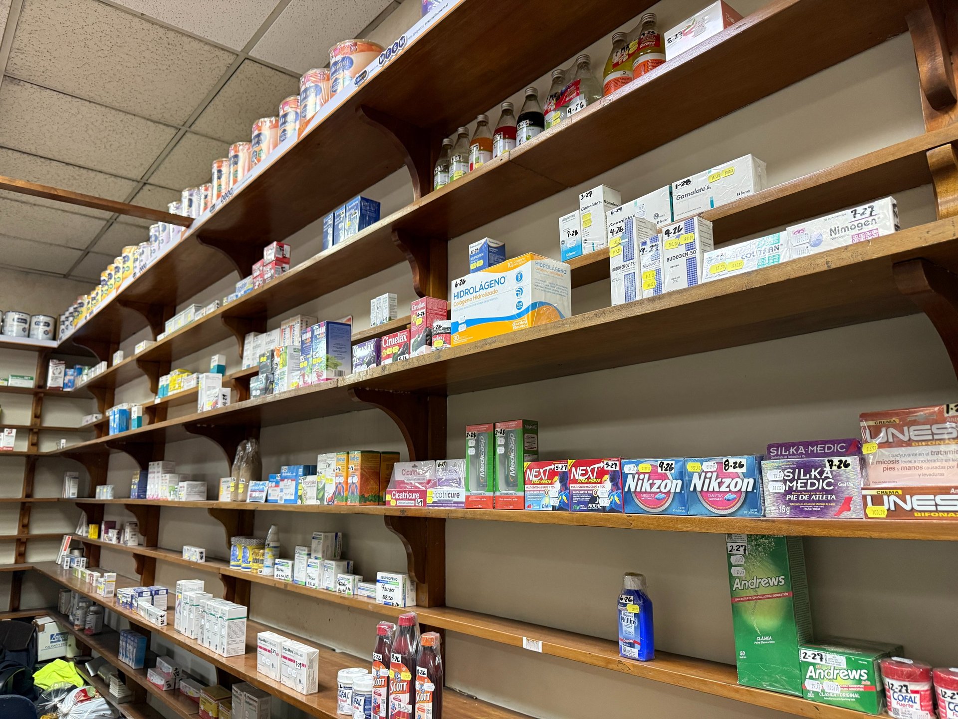 woman wearing yellow long-sleeved dress under white clouds and blue sky during daytime