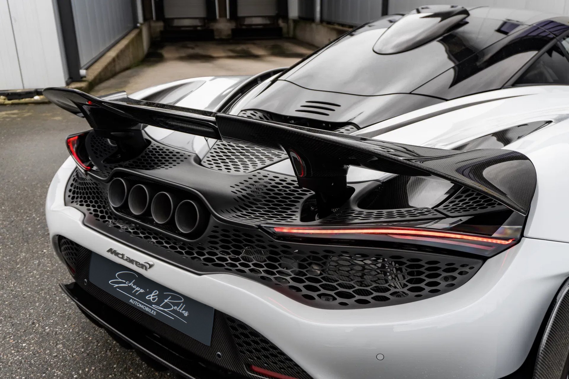 an abstract photo of a curved building with a blue sky in the background
