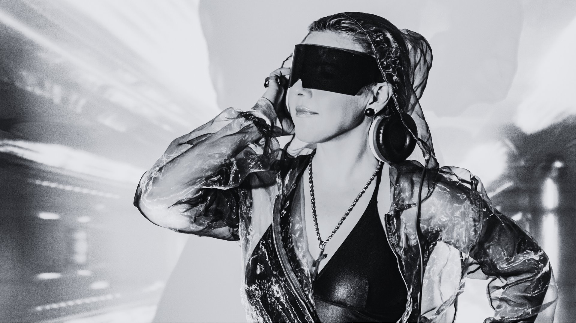 an abstract photo of a curved building with a blue sky in the background