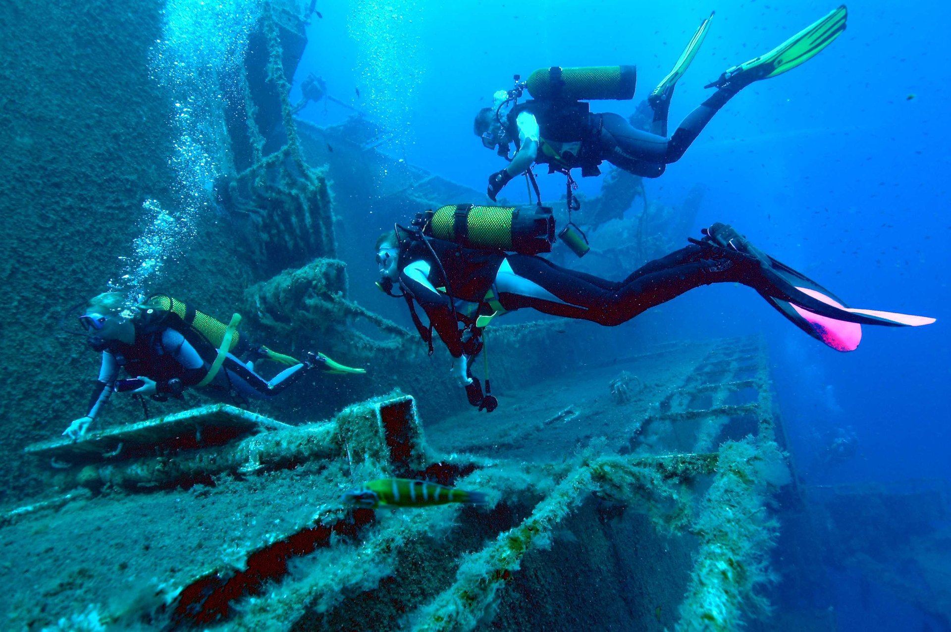 woman wearing water goggles underwater