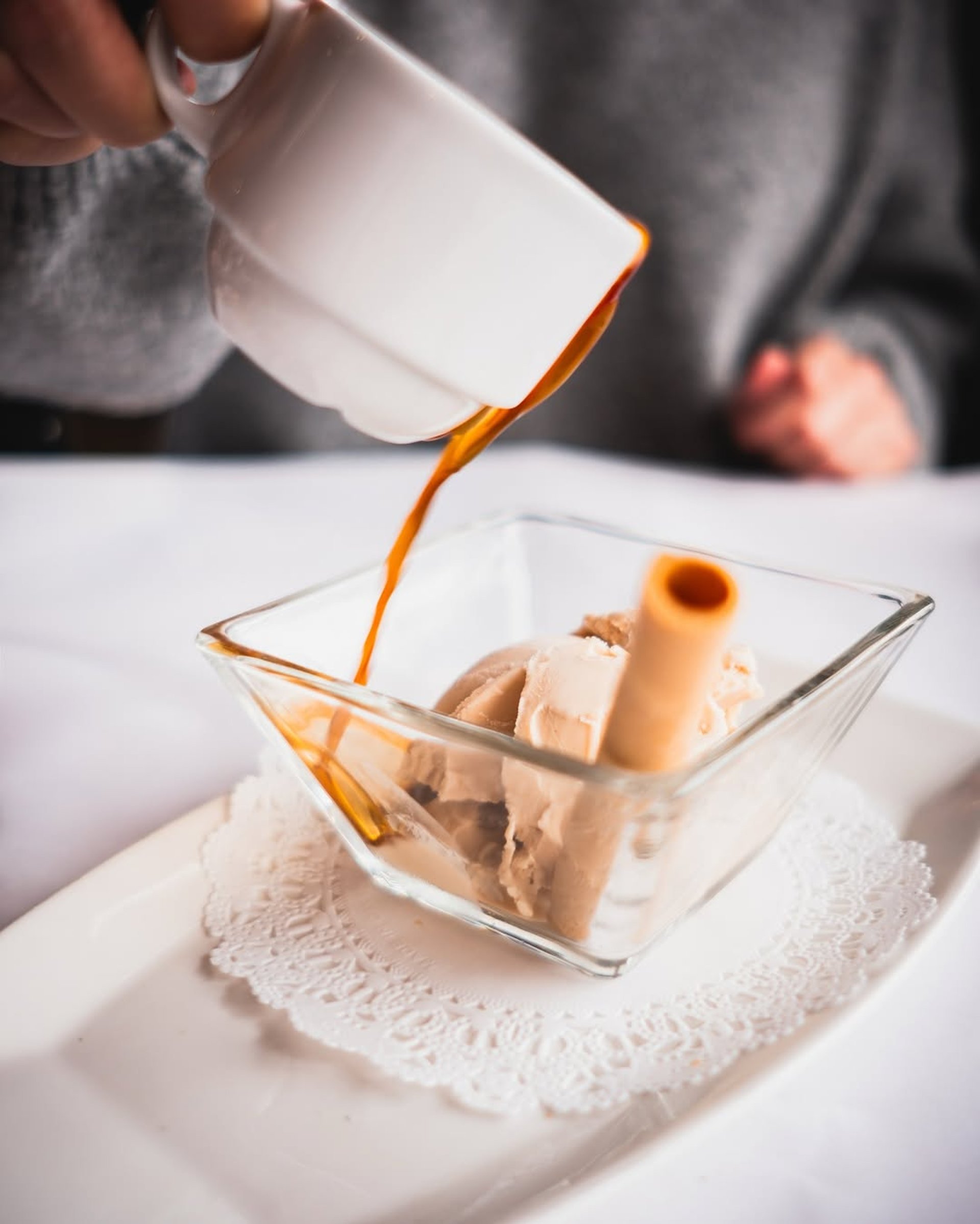 an abstract photo of a curved building with a blue sky in the background