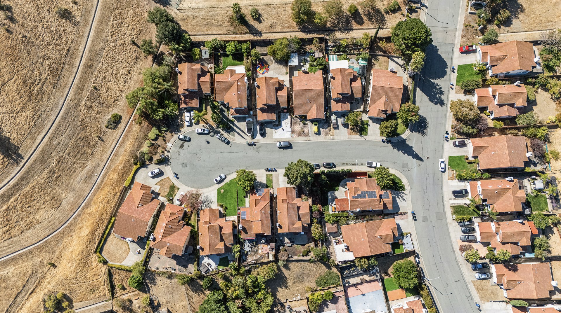 an abstract photo of a curved building with a blue sky in the background