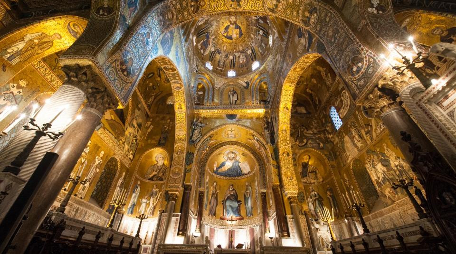 an abstract photo of a curved building with a blue sky in the background