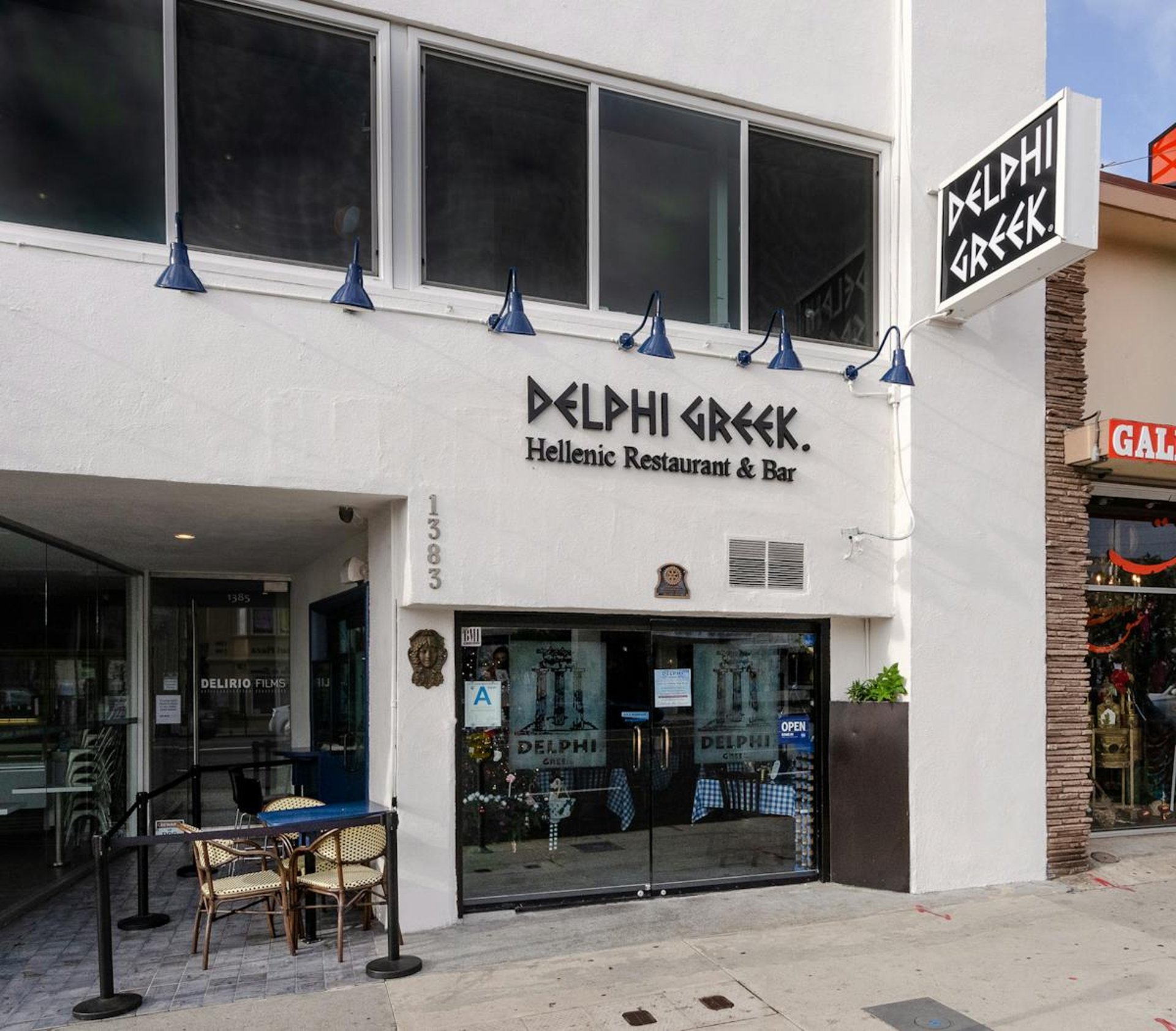 woman wearing yellow long-sleeved dress under white clouds and blue sky during daytime