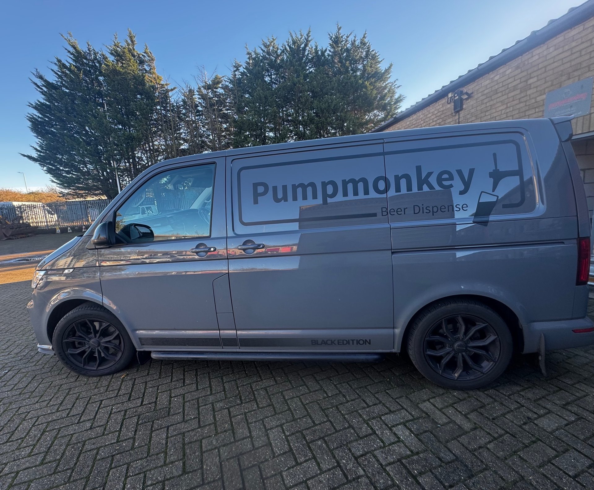 an abstract photo of a curved building with a blue sky in the background