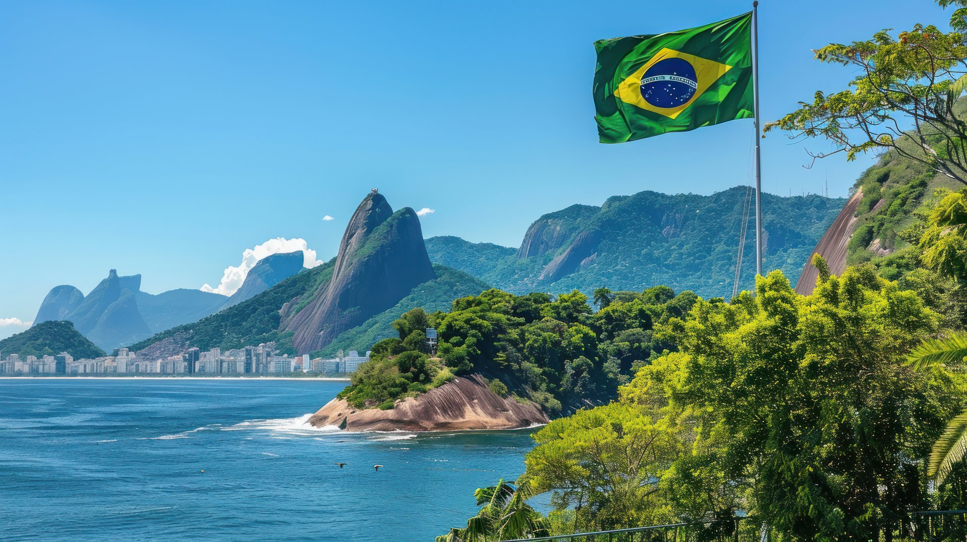blue sea beside brown rocky mountain under blue sky during daytime
