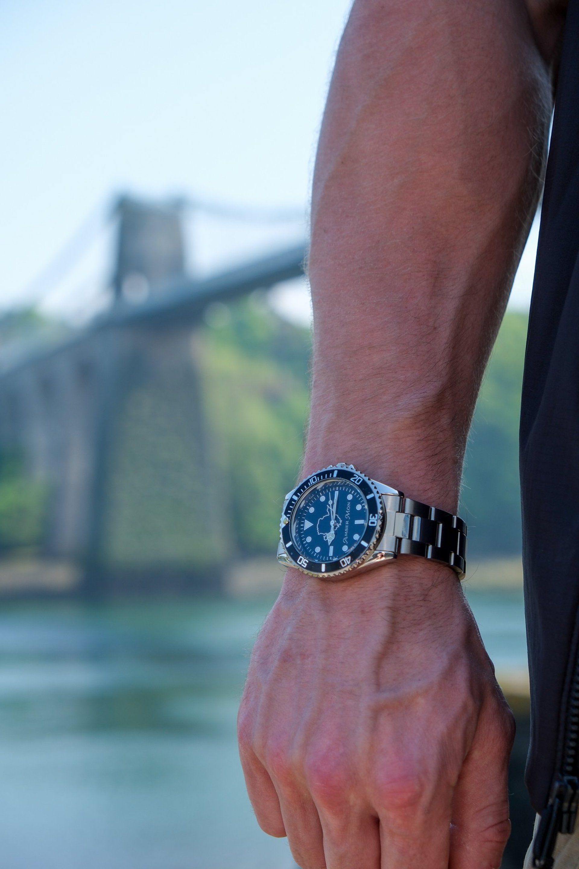 Amser Mon watch being worn next to Menai Bridge, Anglesey.