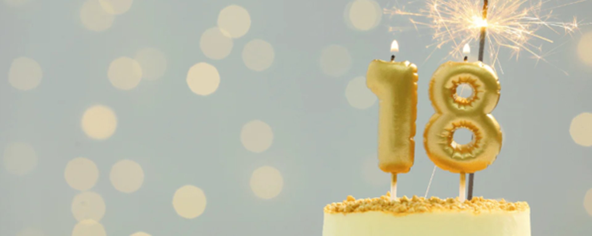 girl in blue shirt lying on white textile
