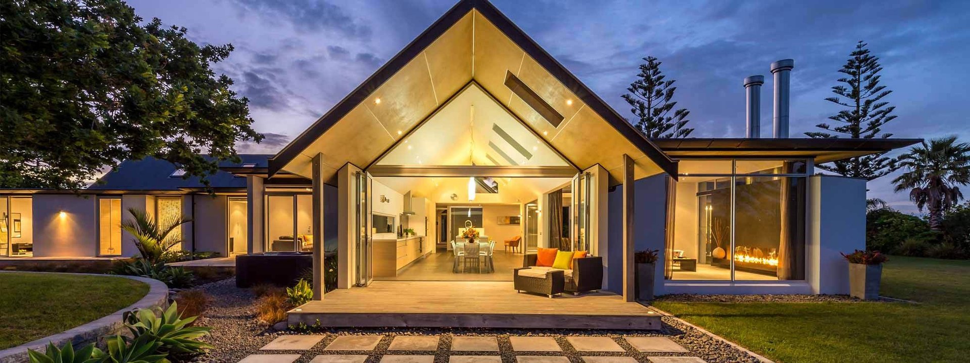 an abstract photo of a curved building with a blue sky in the background
