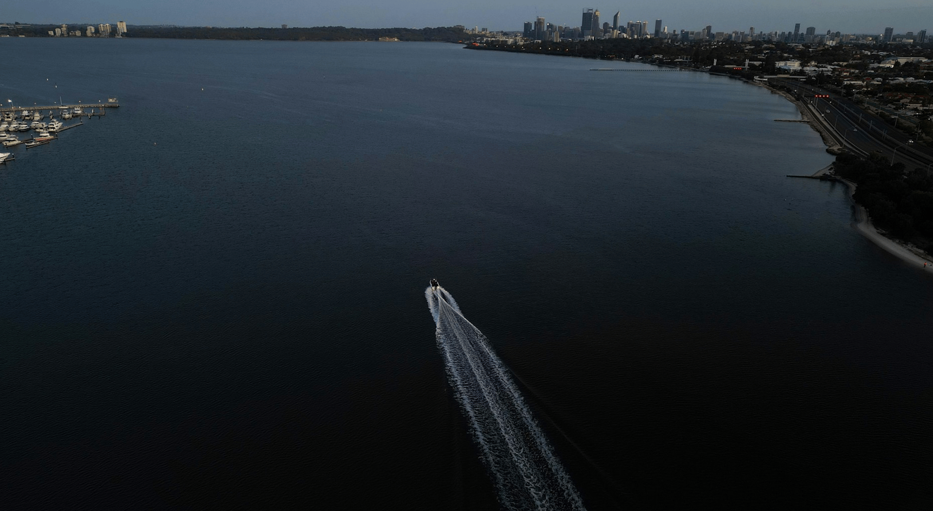 white and black boat on sea during daytime