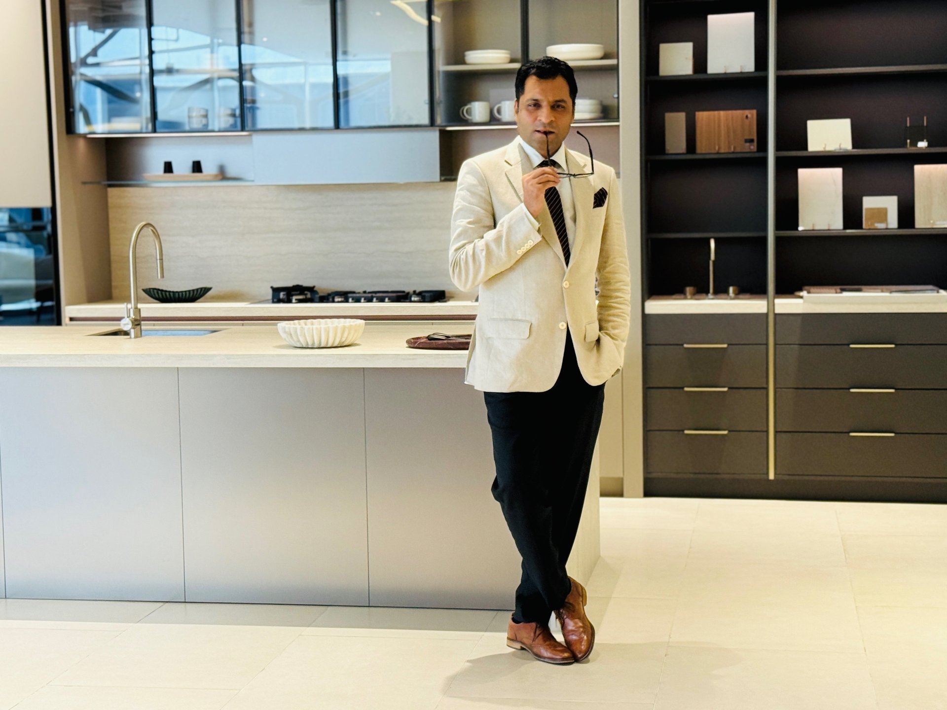 an abstract photo of a curved building with a blue sky in the background