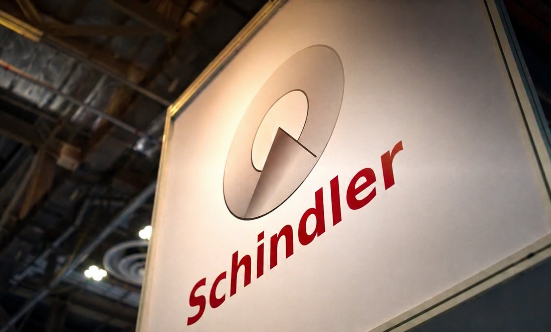 an abstract photo of a curved building with a blue sky in the background