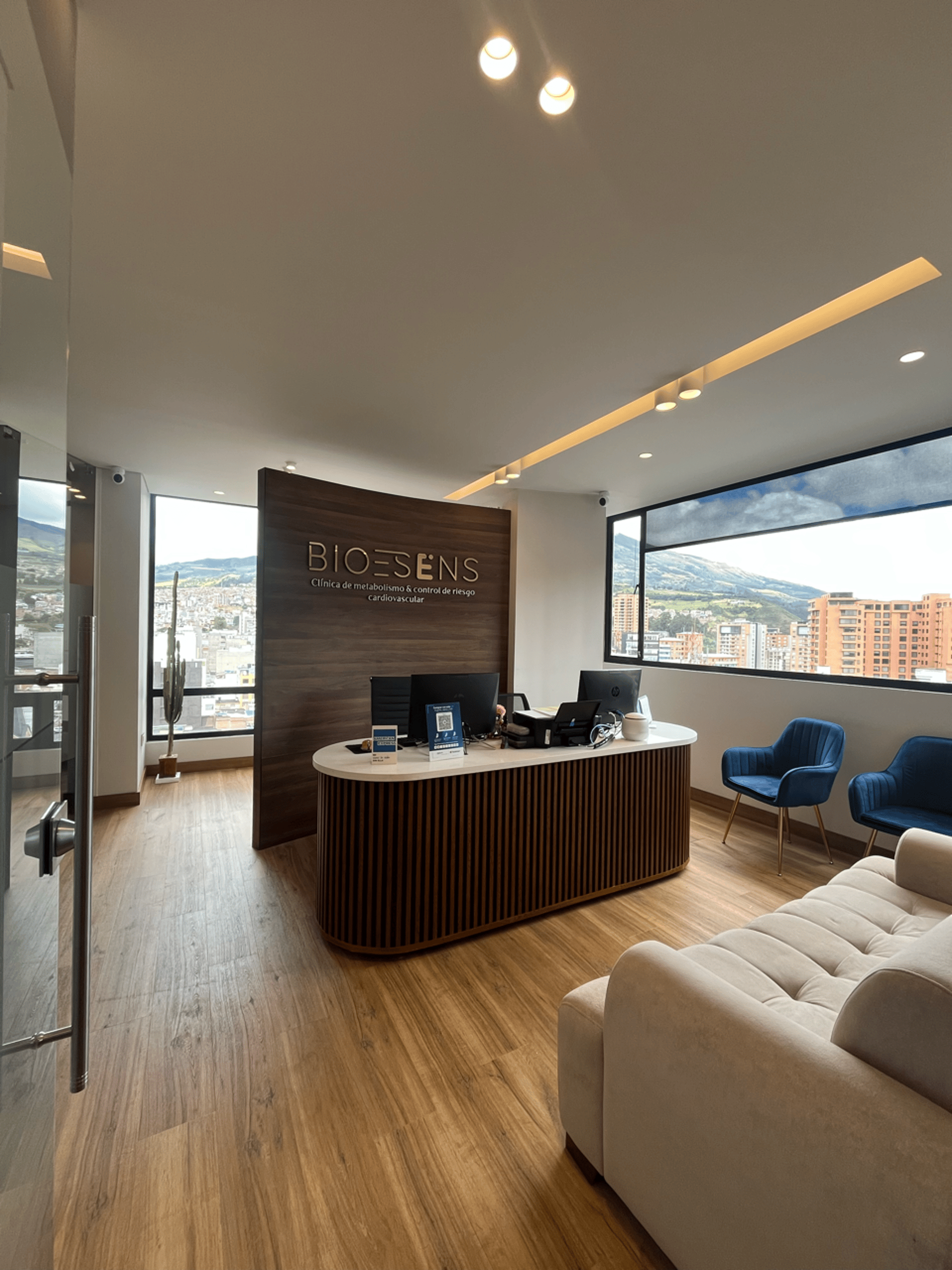 an abstract photo of a curved building with a blue sky in the background