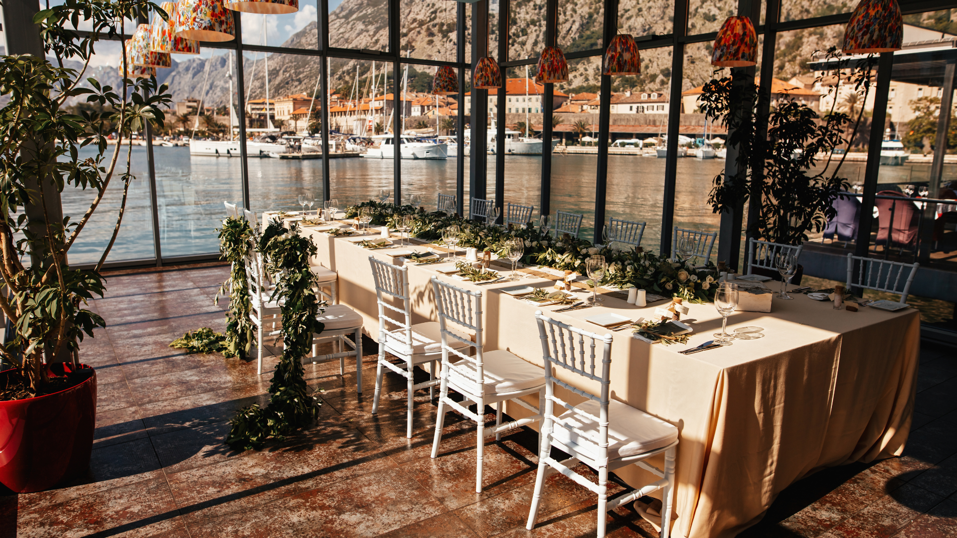 group of people sitting beside rectangular wooden table with laptops