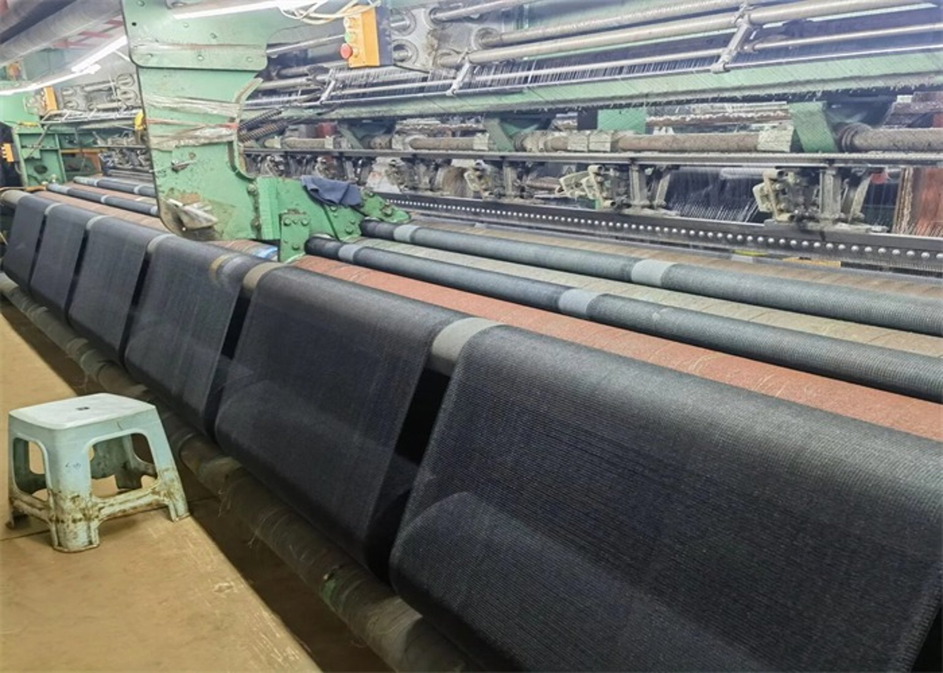 an abstract photo of a curved building with a blue sky in the background