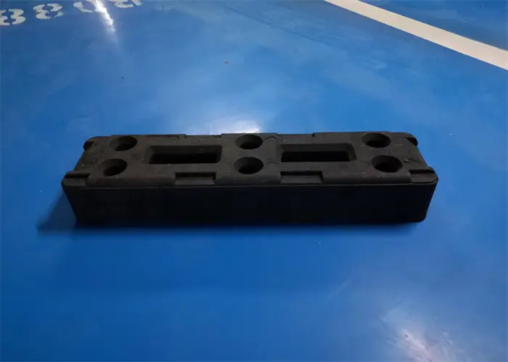 an abstract photo of a curved building with a blue sky in the background