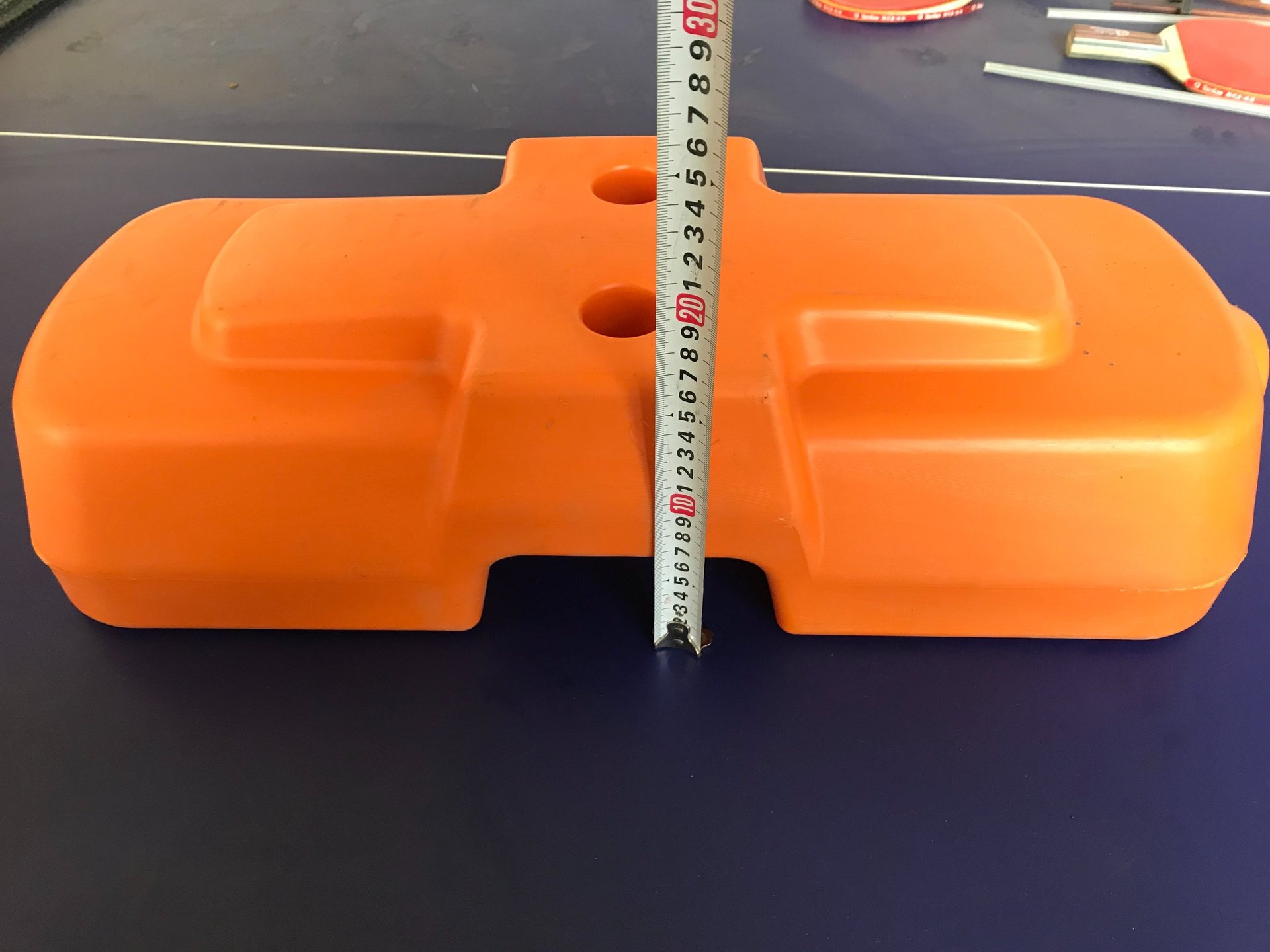 an abstract photo of a curved building with a blue sky in the background