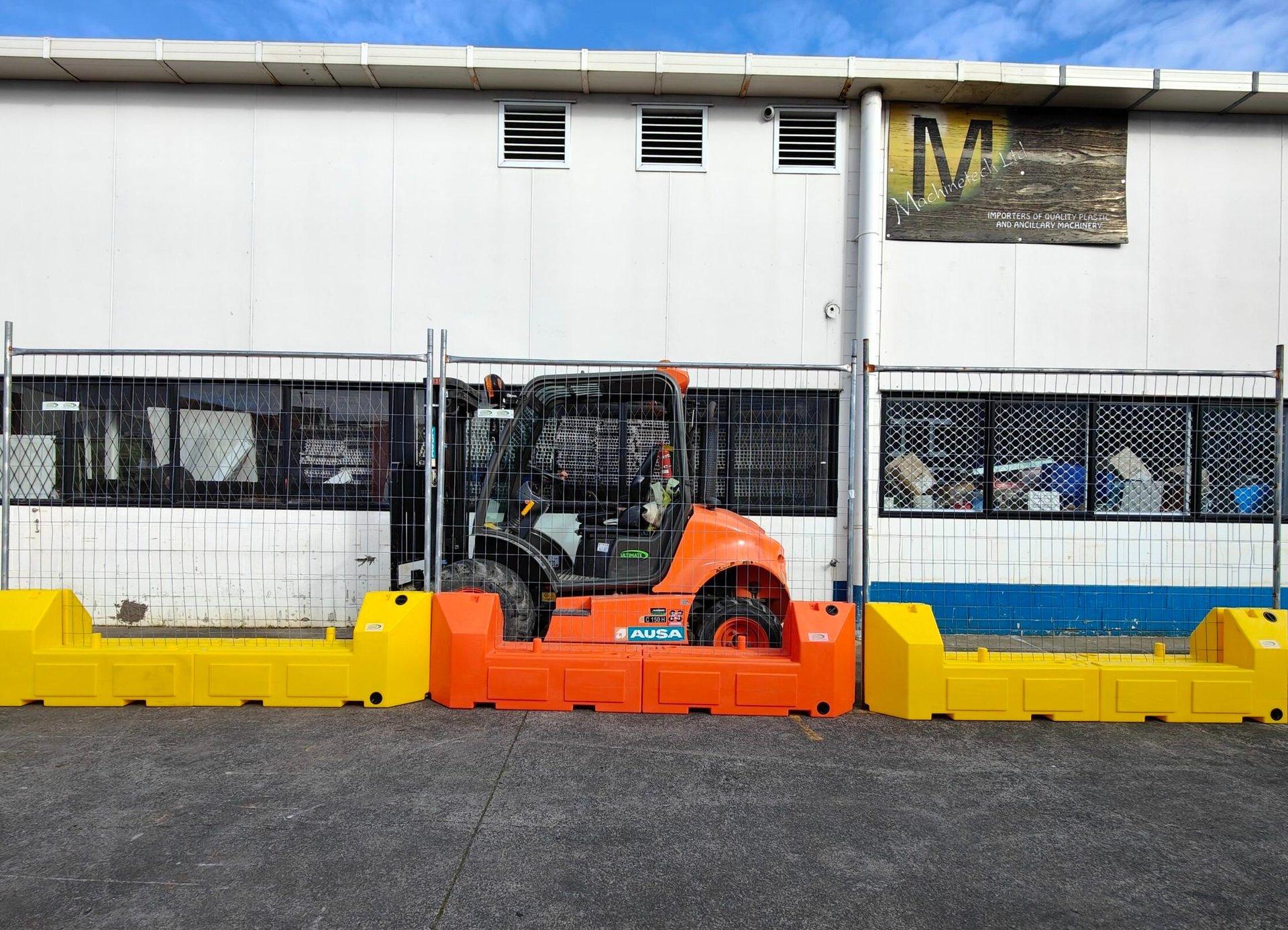 an abstract photo of a curved building with a blue sky in the background