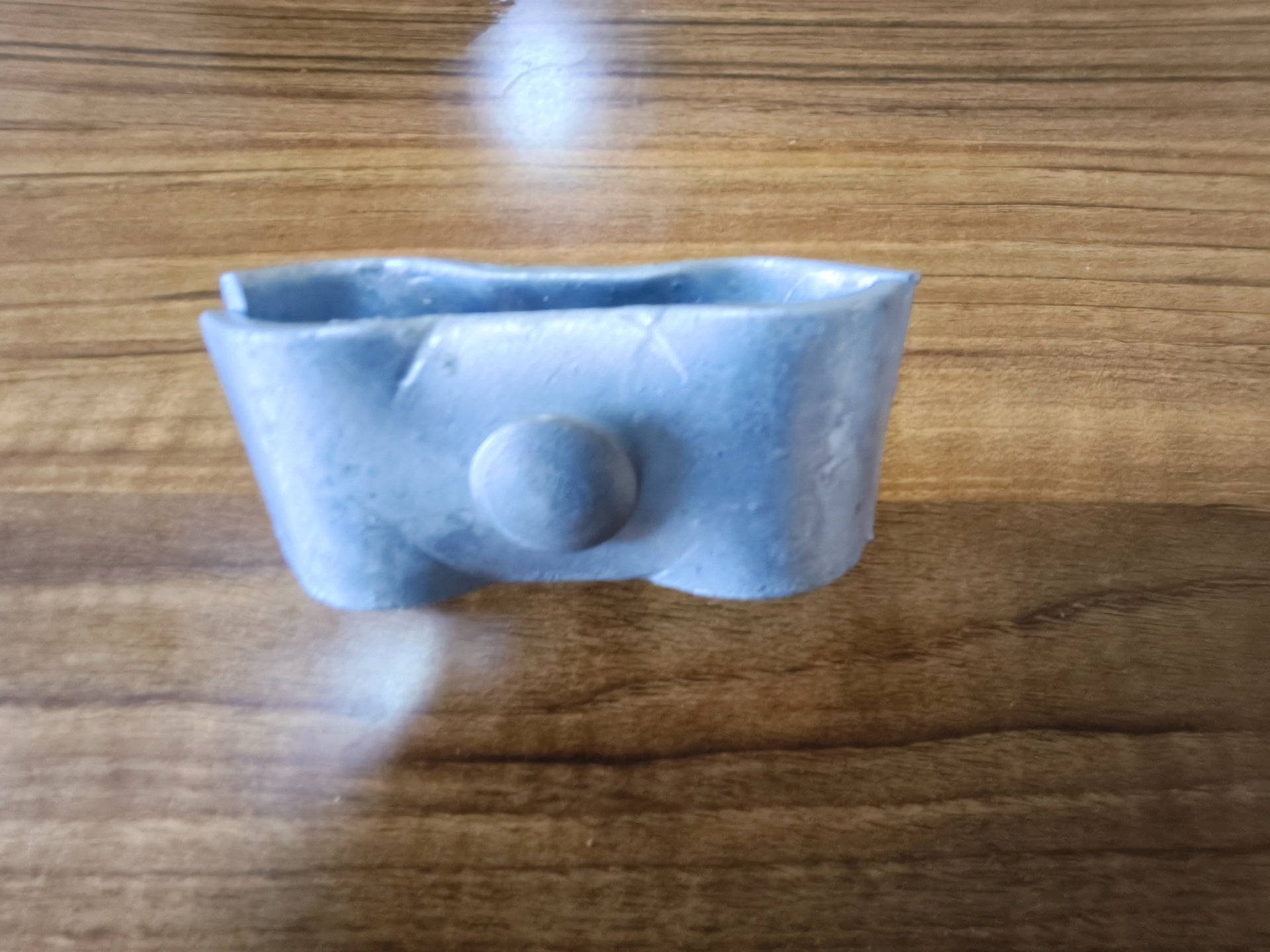 an abstract photo of a curved building with a blue sky in the background