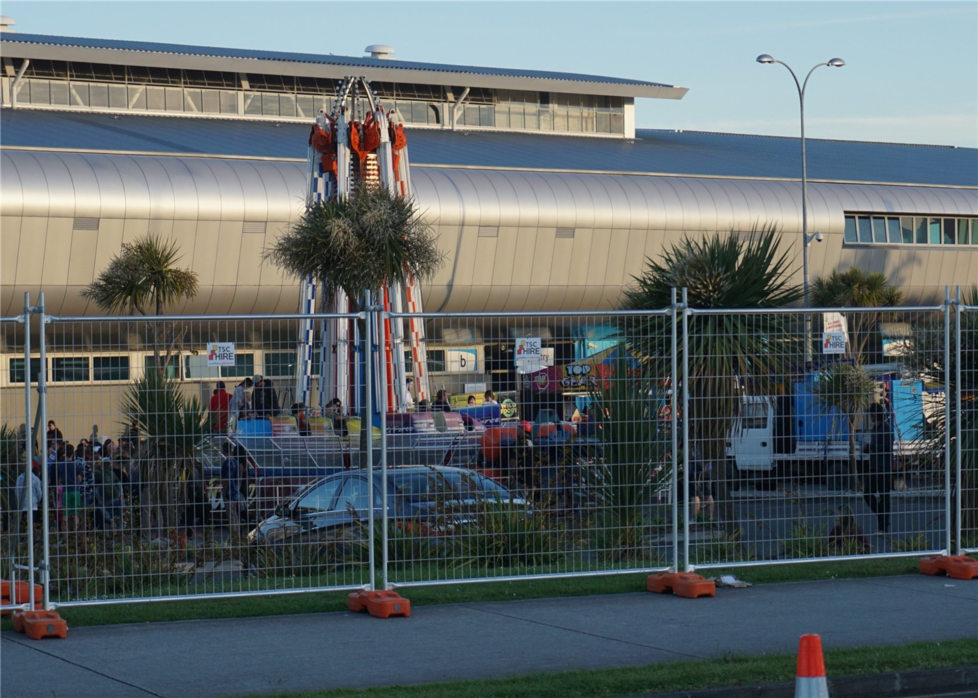 an abstract photo of a curved building with a blue sky in the background
