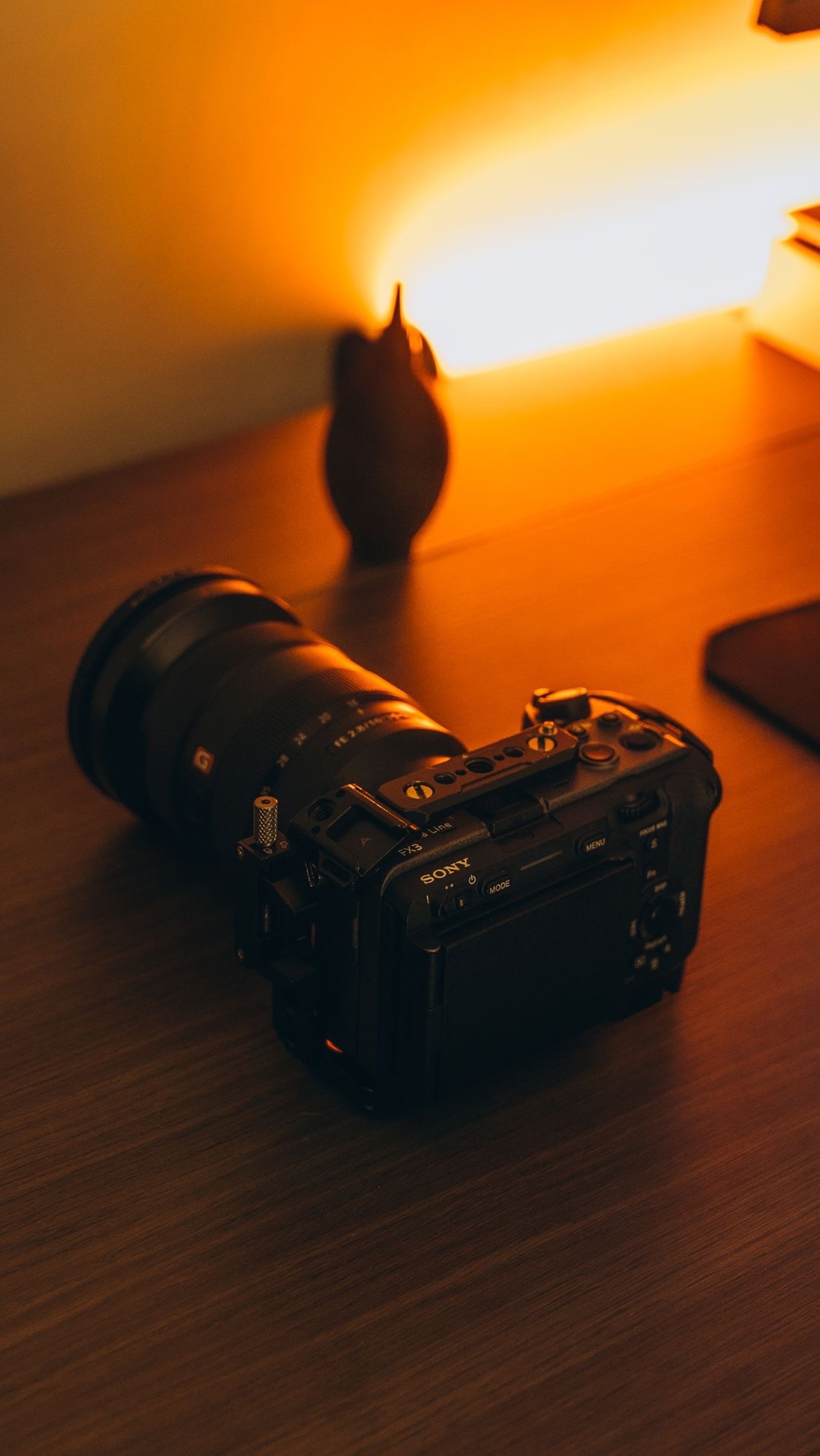 grayscale photo of camera on table