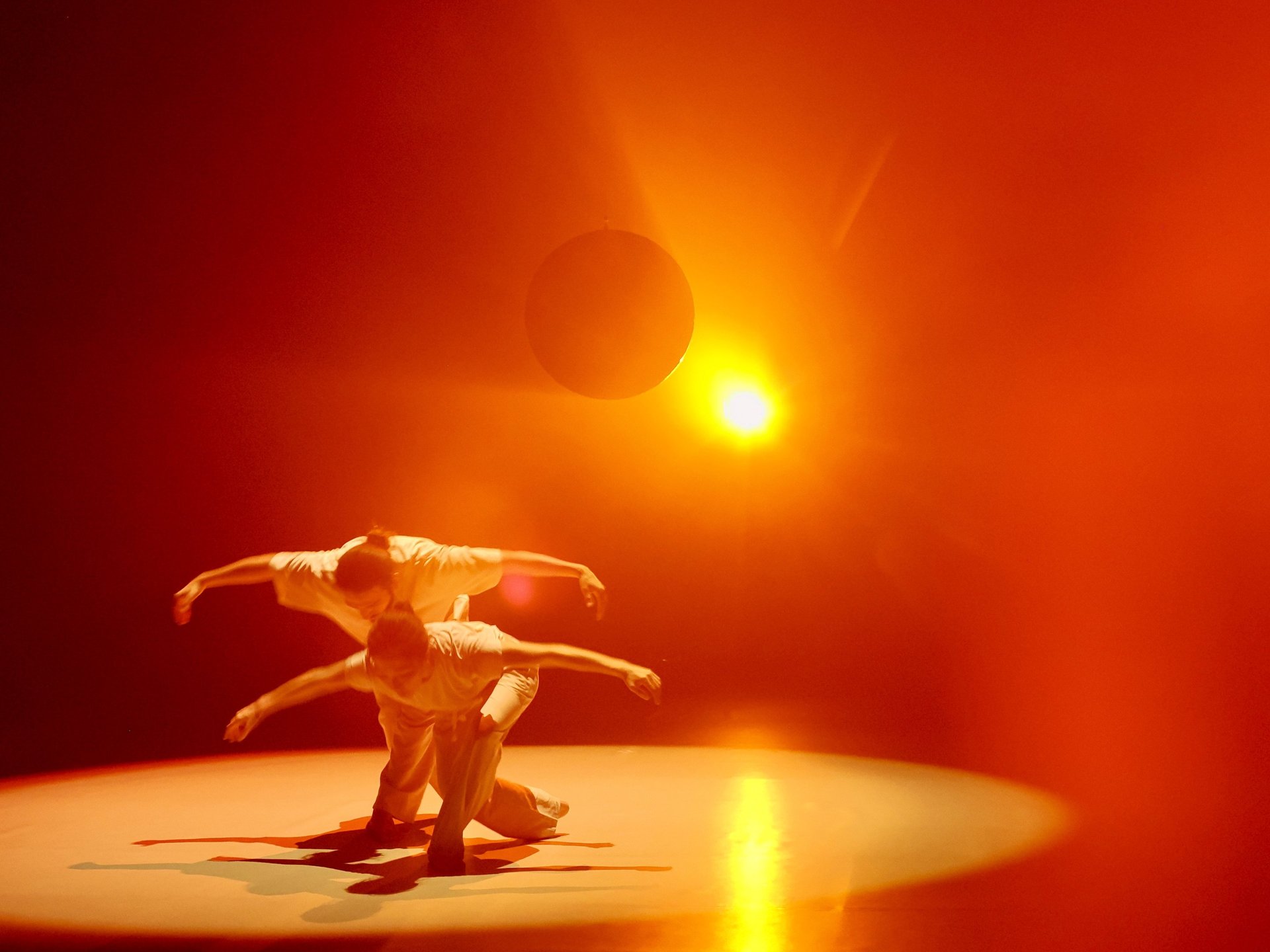an abstract photo of a curved building with a blue sky in the background