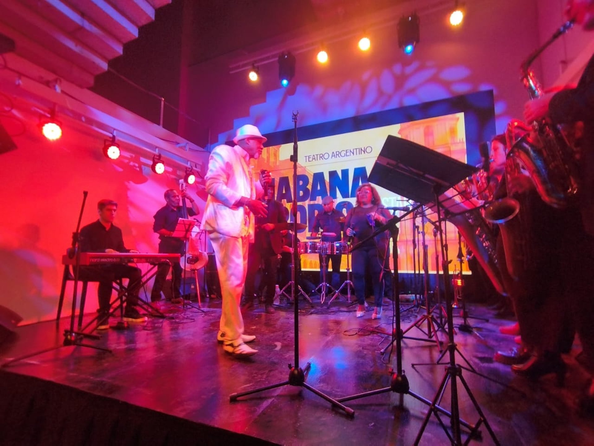 an abstract photo of a curved building with a blue sky in the background