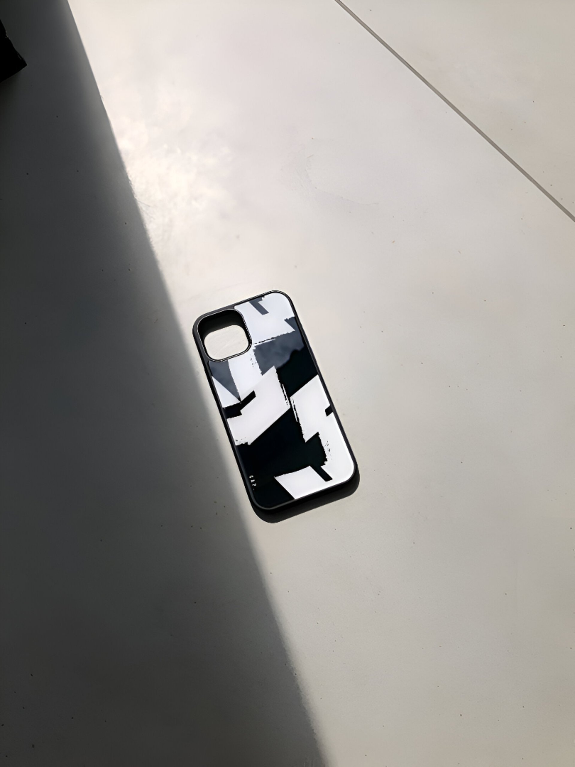 white smartphone on brown wooden table