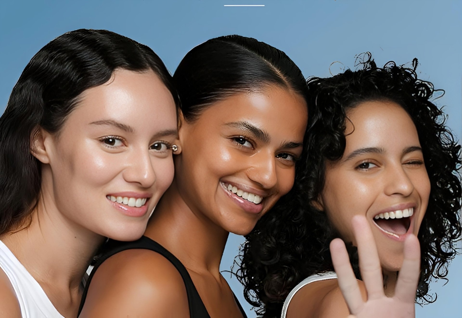 a woman laying on the ground with a peace sign in her hand