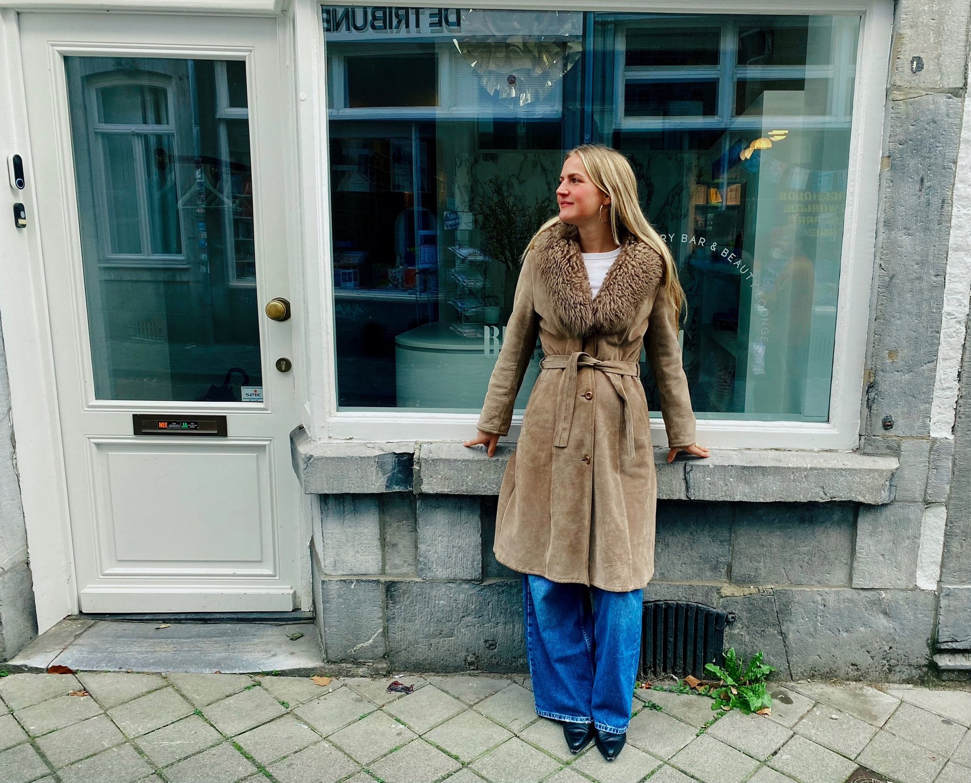 an abstract photo of a curved building with a blue sky in the background