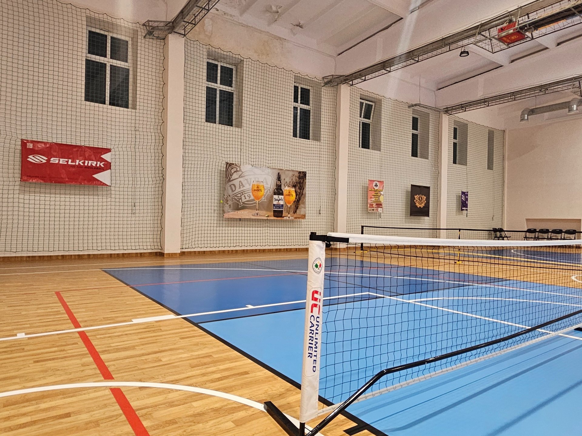 an abstract photo of a curved building with a blue sky in the background