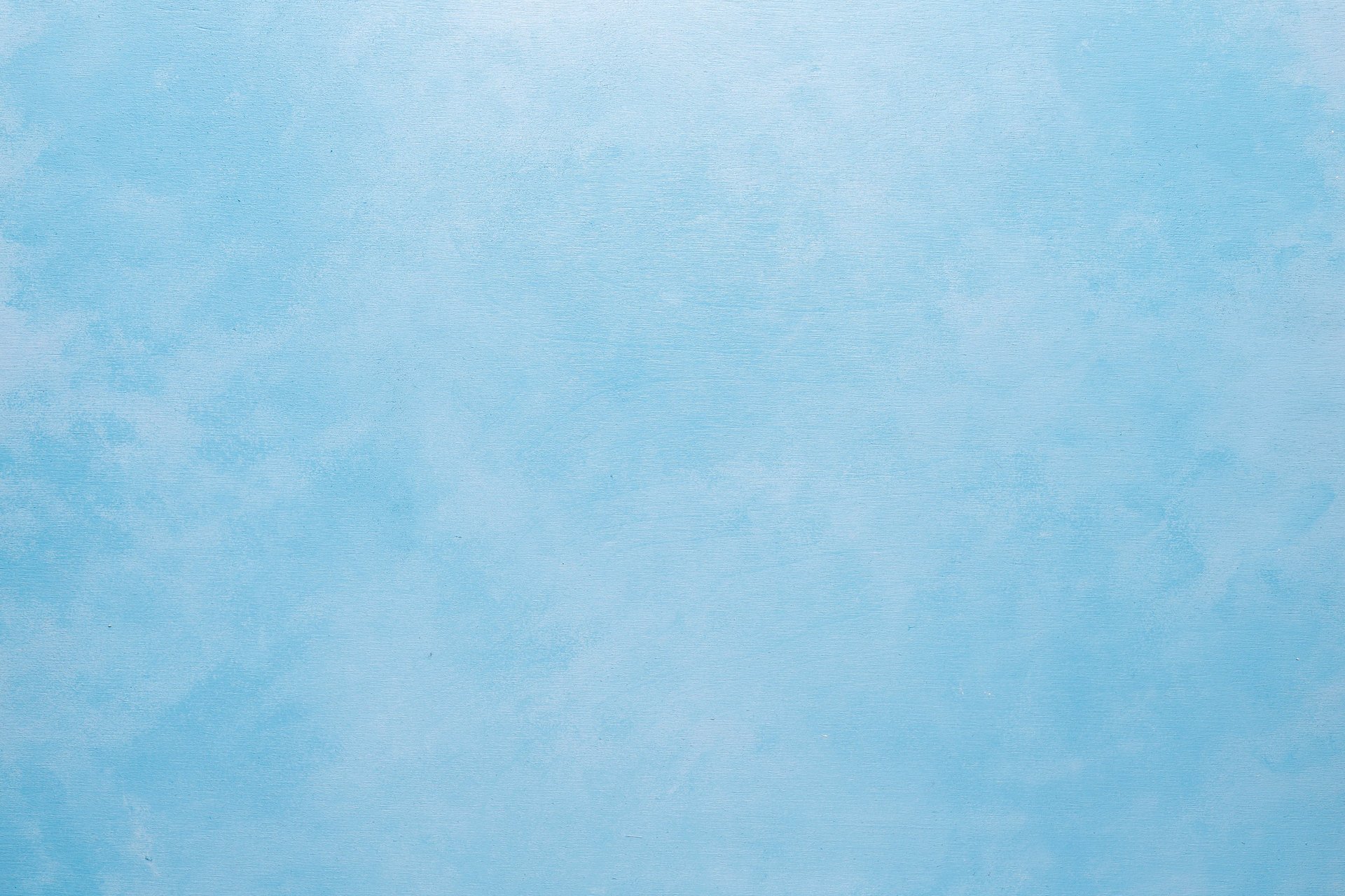 a person washing a car with a sponge