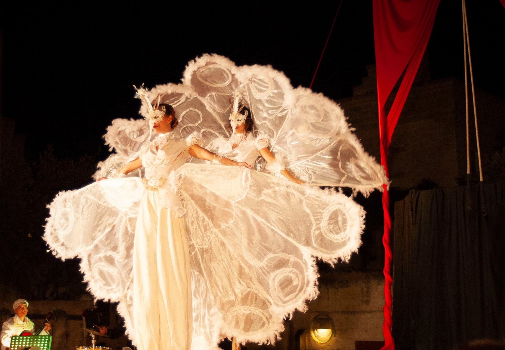 woman wearing yellow long-sleeved dress under white clouds and blue sky during daytime