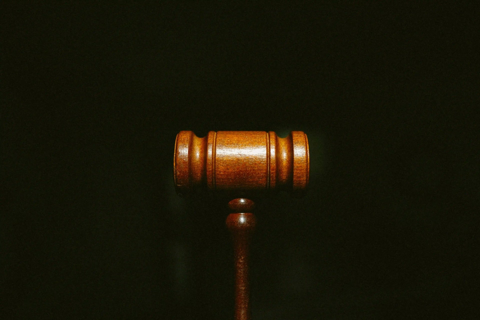 brown wooden stand with black background