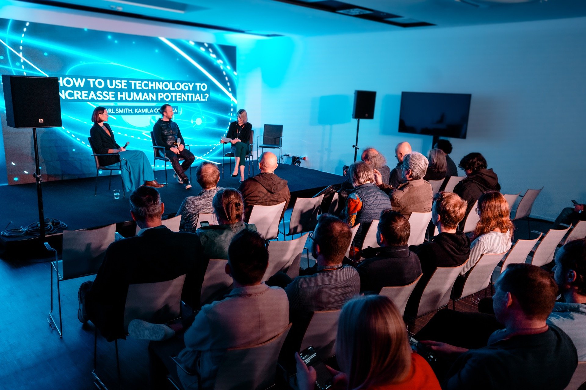silhouette of person standing on rock surrounded by body of water