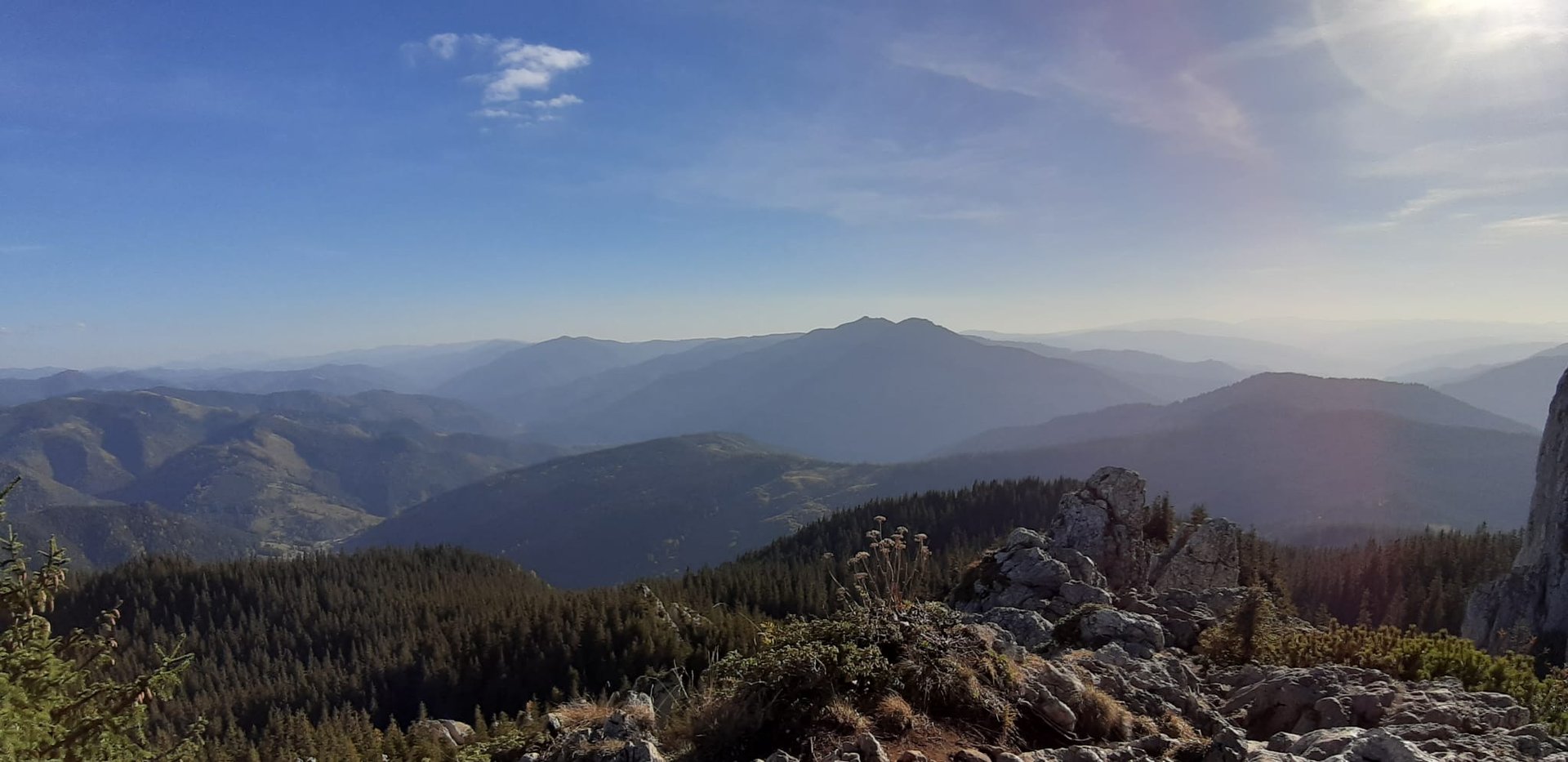 two person standing on mountain during sunset