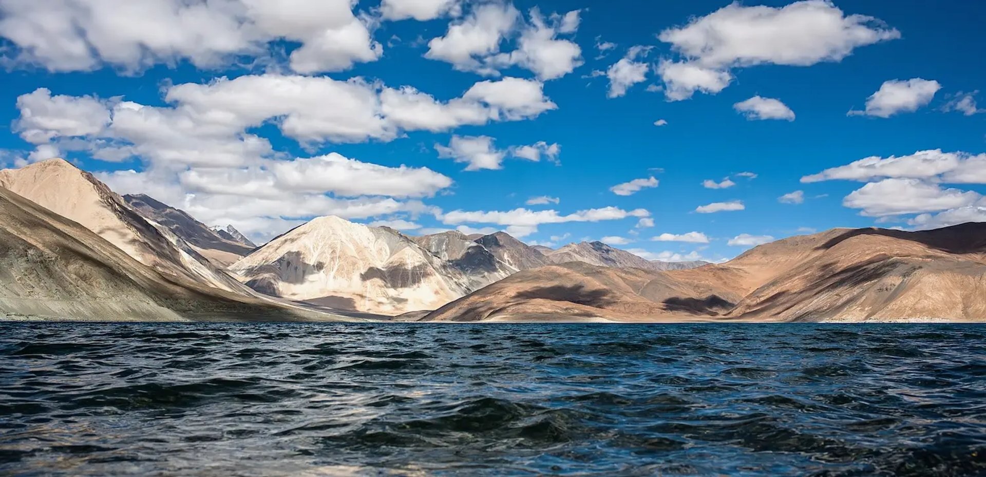 Pangong Tso Lake surrounded by mountains in Ladakh