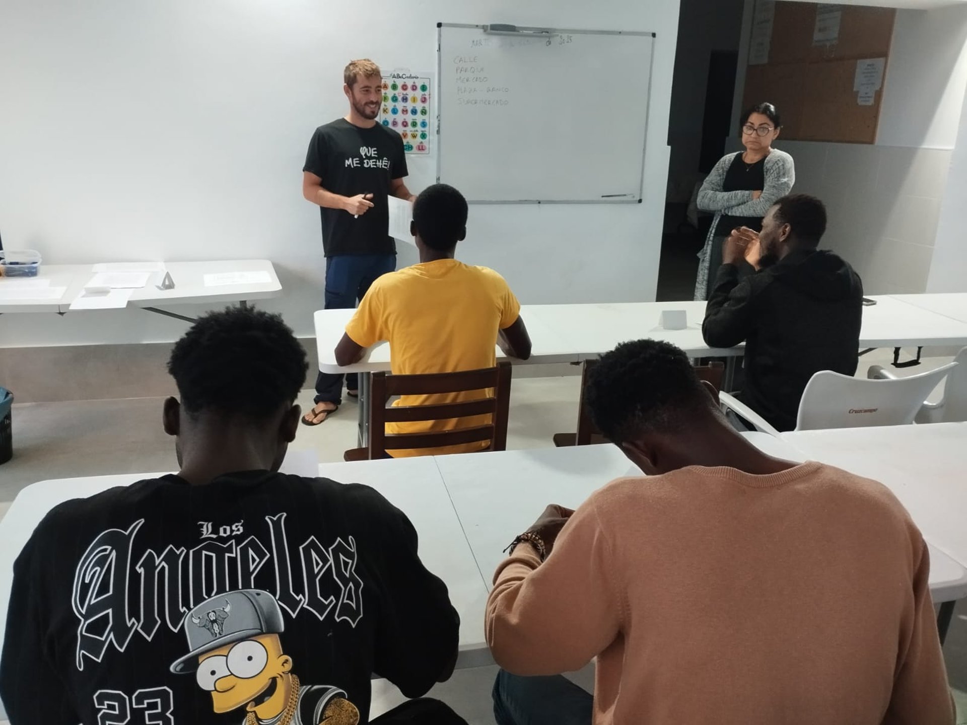 black rolling chair near brown wooden table