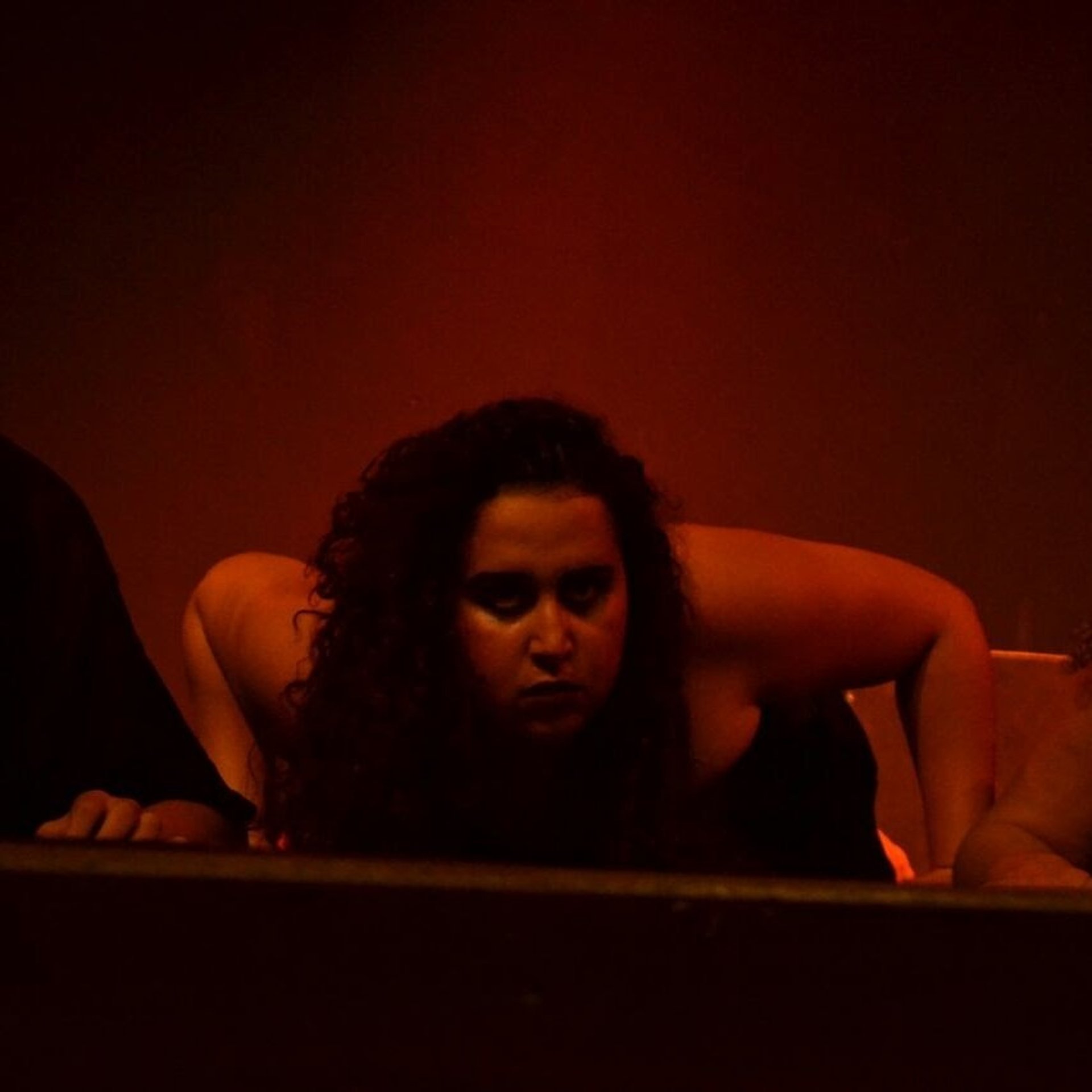 an abstract photo of a curved building with a blue sky in the background