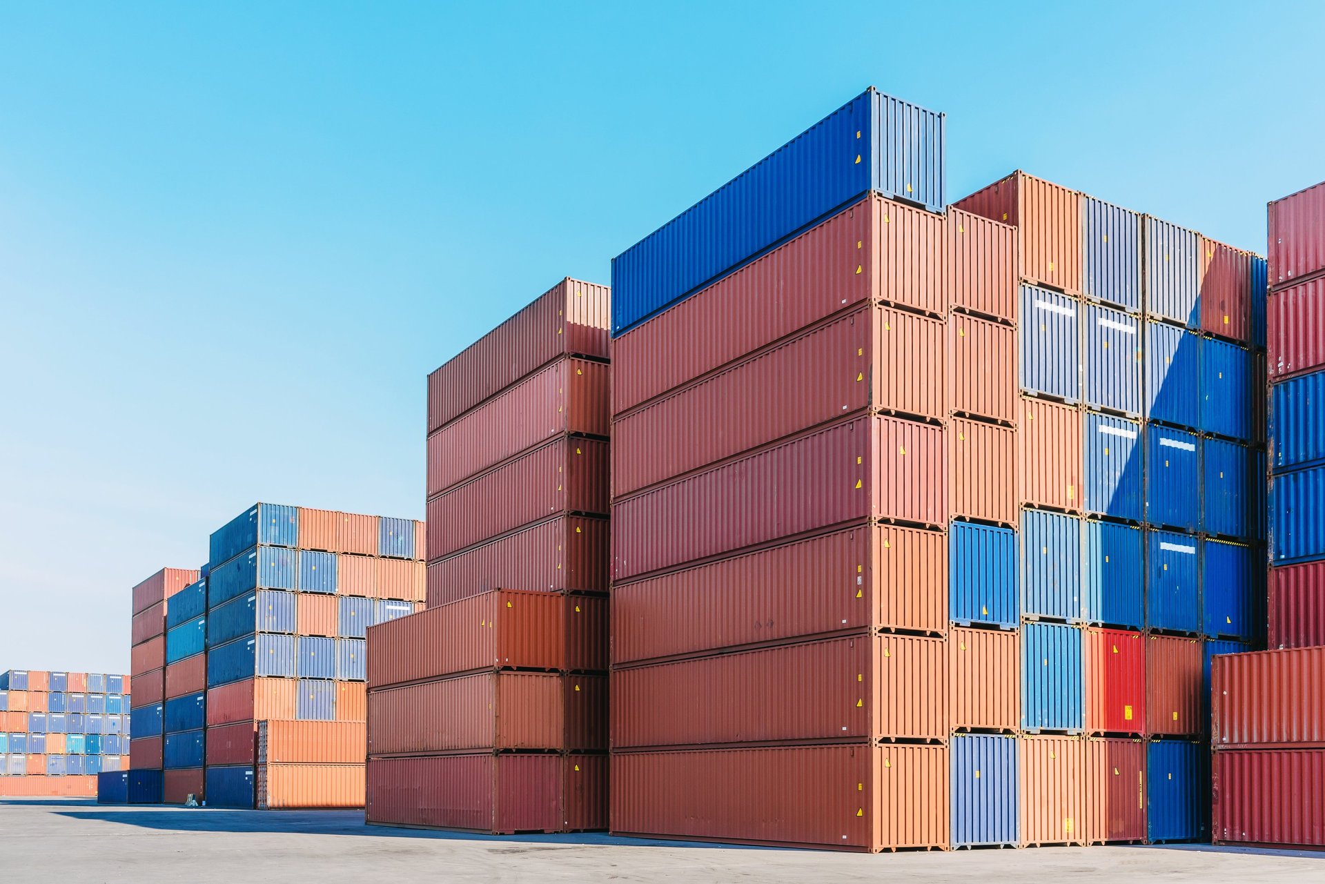 woman wearing yellow long-sleeved dress under white clouds and blue sky during daytime