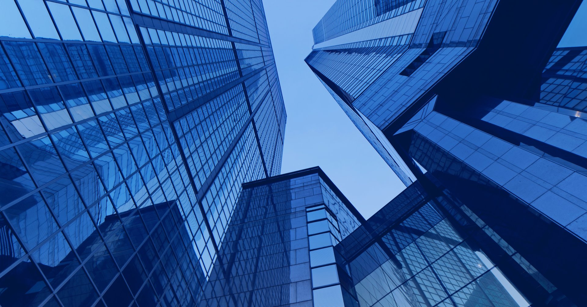 low angle photo of city high rise buildings during daytime