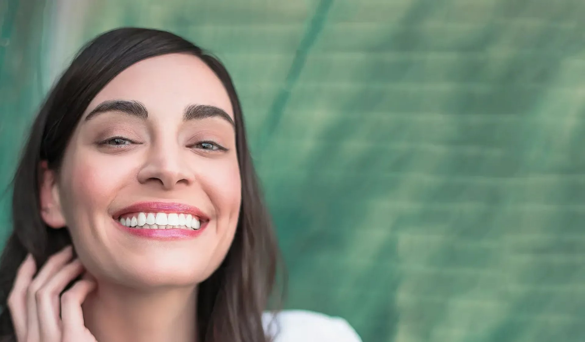 an abstract photo of a curved building with a blue sky in the background